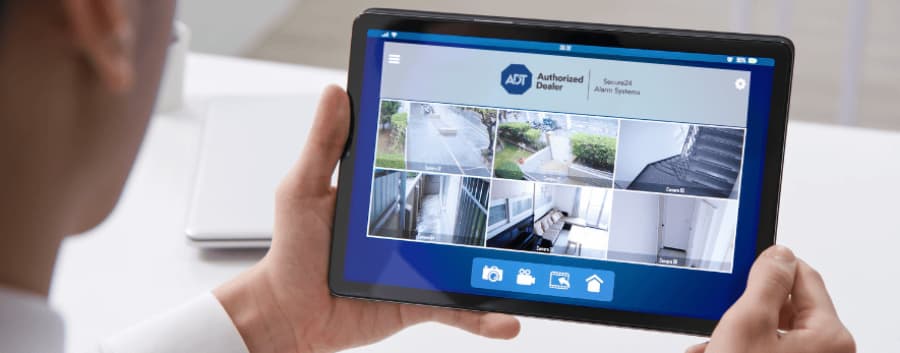 Homeowner watching surveillance streams on a mobile device